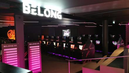 Belong gaming arena with faux neon acrylic lettering, free standing magnetic scoreboards and changeable magnetic desk ends.