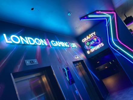 Gravity E-Sports entrance with faux neon lettering, logo and light feature.